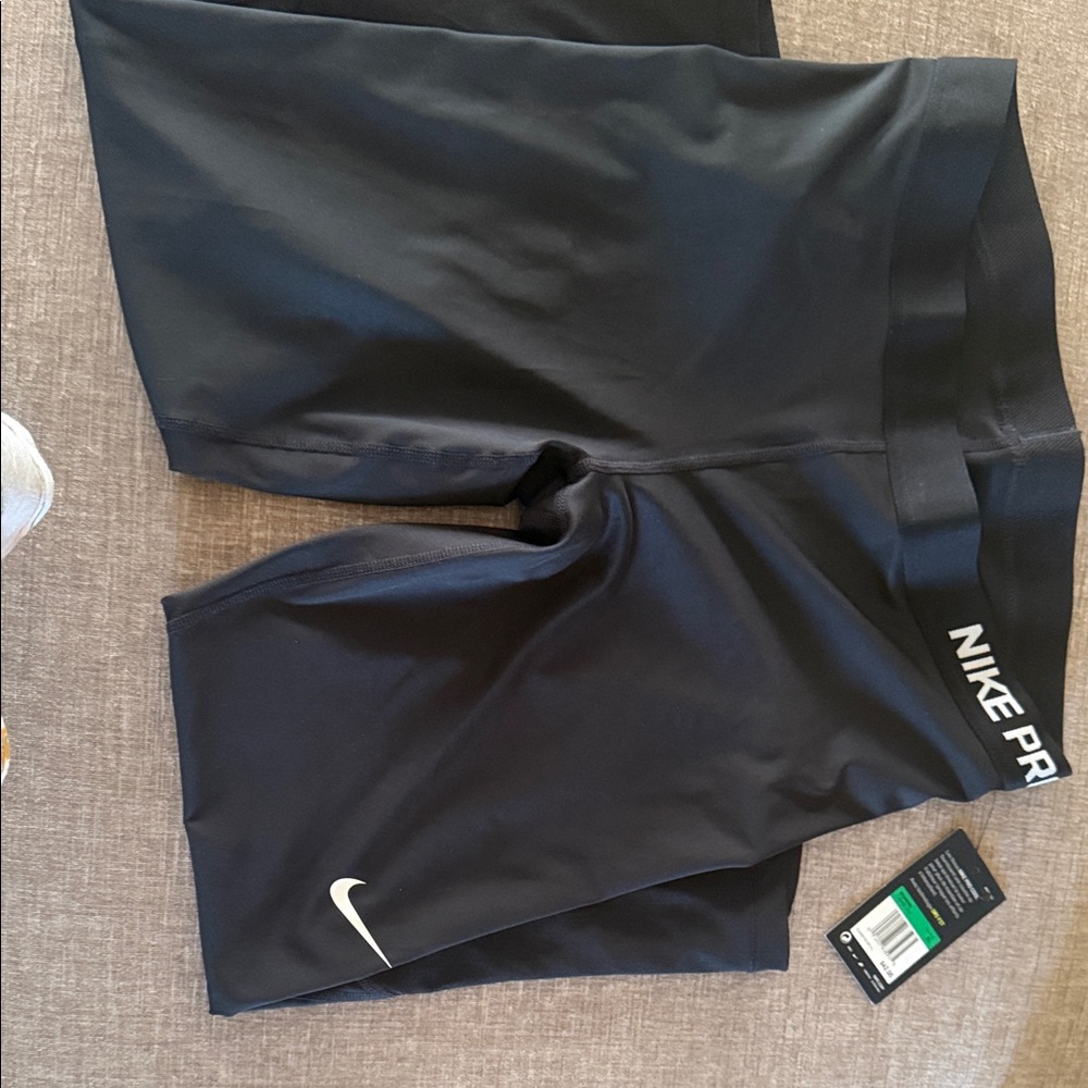 Nike Black Athletic Compression Shorts with White Swoosh